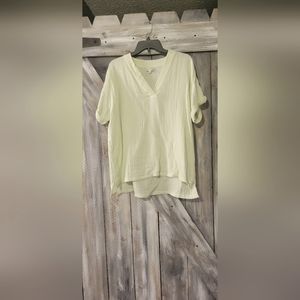 Light green blouse beautiful and fits loose around waist line.